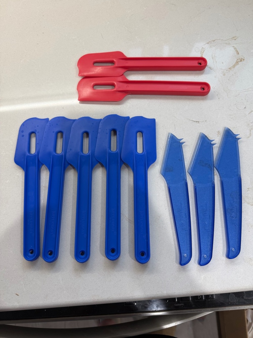 Set of Blue and Red Plastic Spatulas and Scrapers